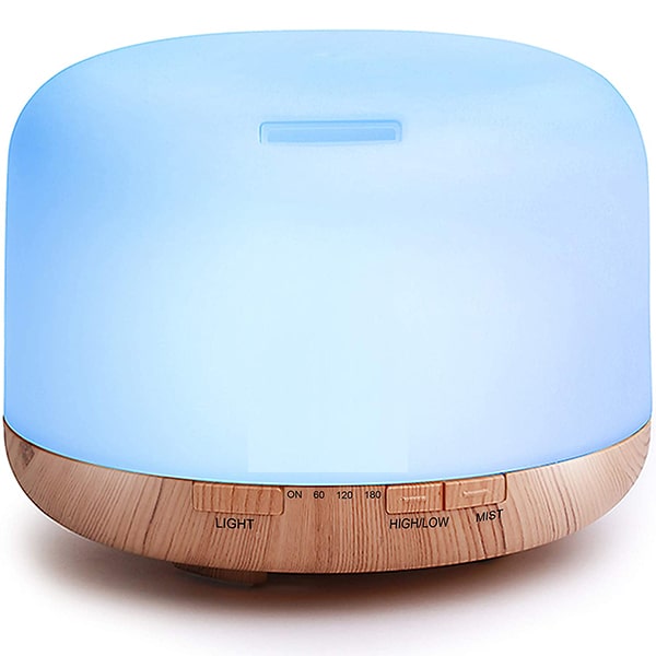 Light wood grain base with glowing blue top; timer and mist controls visible.